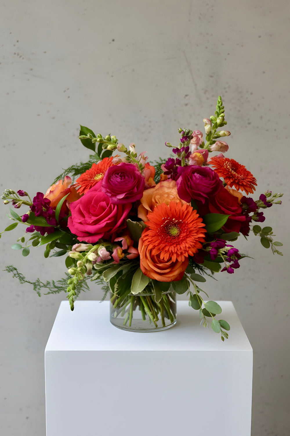 roses, gerbera daisies, ranunculus in hot pinks and oranges