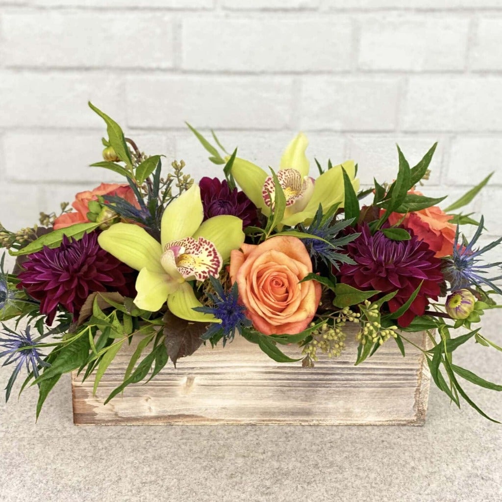 orchids, dahlias, thistle, roses, ecualyptus